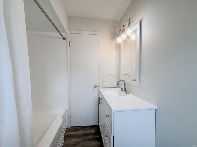 2425 Ojibway Trl, Fort Wayne, IN 46809 - bathroom with wood finished floors, vanity, and shower / tub combo with curtain