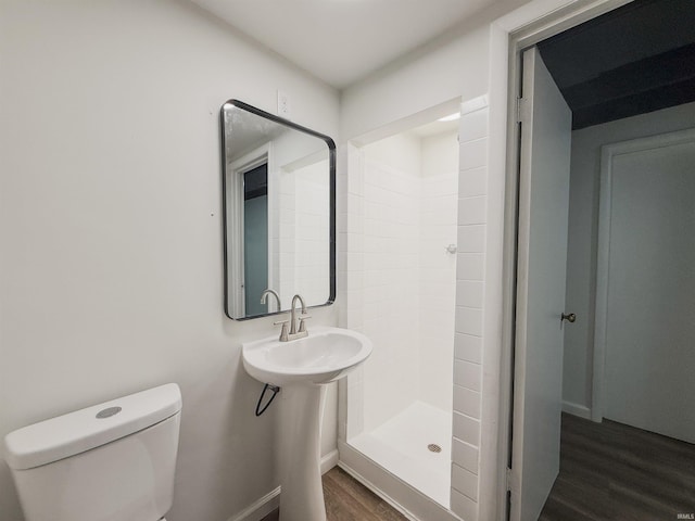 2425 Ojibway Trl, Fort Wayne, IN 46809 - bathroom featuring wood finished floors, a stall shower, and toilet