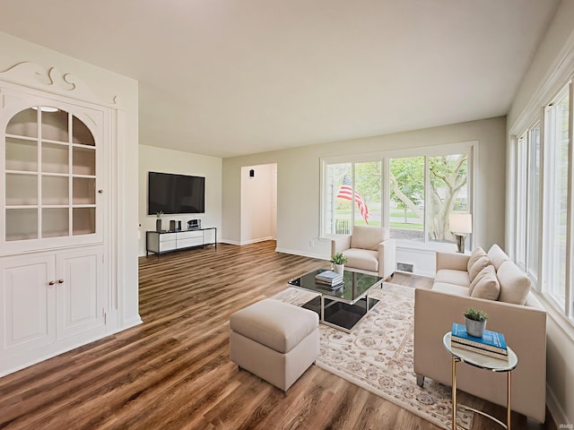 2425 Ojibway Trl, Fort Wayne, IN 46809 - living room featuring wood finished floors, plenty of natural light, and baseboards
