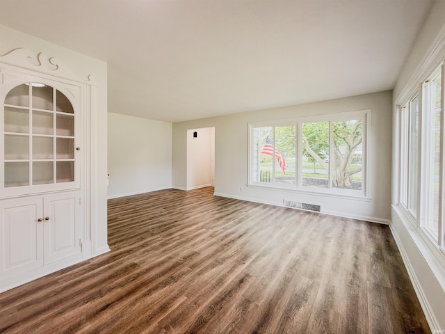 2425 Ojibway Trl, Fort Wayne, IN 46809 - spare room with wood finished floors, plenty of natural light, and baseboards