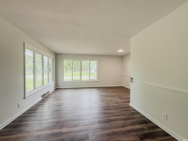 2425 Ojibway Trl, Fort Wayne, IN 46809 - unfurnished room featuring baseboards, dark wood-type flooring, and recessed lighting