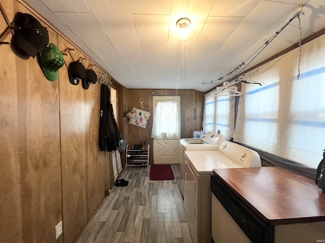 400 Burlington Ave, Logansport, IN 46947 - laundry room with washing machine and clothes dryer, wood finished floors, and wooden walls