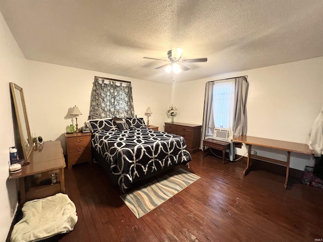 400 Burlington Ave, Logansport, IN 46947 - bedroom with wood-type flooring, a textured ceiling, and a ceiling fan