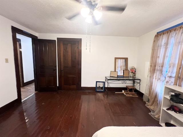 400 Burlington Ave, Logansport, IN 46947 - bedroom featuring hardwood / wood-style flooring, baseboards, a textured ceiling, and a ceiling fan