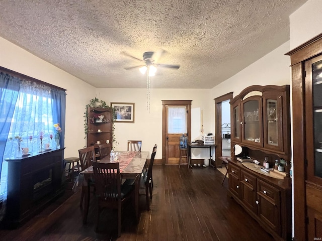 400 Burlington Ave, Logansport, IN 46947 - dining space featuring dark wood finished floors, ceiling fan, a textured ceiling, and baseboards