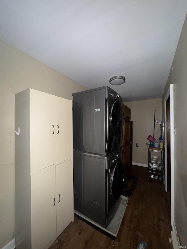 457 E Leith St, Fort Wayne, IN 46806 - laundry room with estacked washer and dryer, cabinet space, wood finished floors, and baseboards