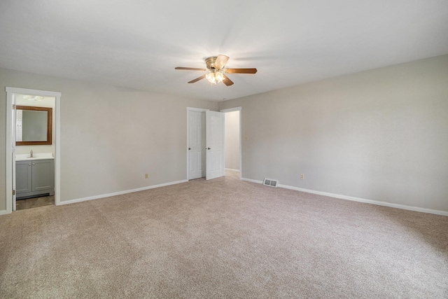 4624 3b Rd, Bremen, IN 46506 - unfurnished bedroom featuring light colored carpet, baseboards, and a sink