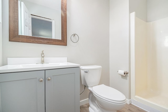 4624 3b Rd, Bremen, IN 46506 - bathroom featuring toilet, wood finished floors, baseboards, vanity, and a stall shower