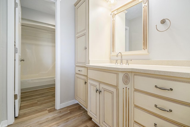 4624 3b Rd, Bremen, IN 46506 - full bathroom with vanity, wood finished floors, toilet, and baseboards
