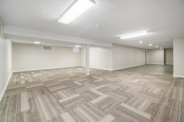 4624 3b Rd, Bremen, IN 46506 - finished basement with light colored carpet, baseboards, and a textured ceiling