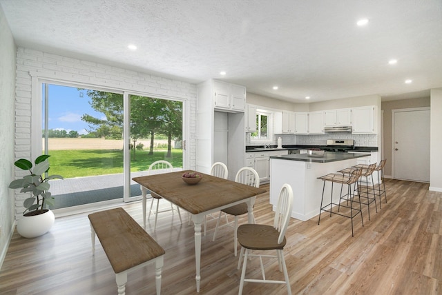 4624 3b Rd, Bremen, IN 46506 - kitchen featuring healthy amount of natural light, white cabinets, a kitchen island, and recessed lighting