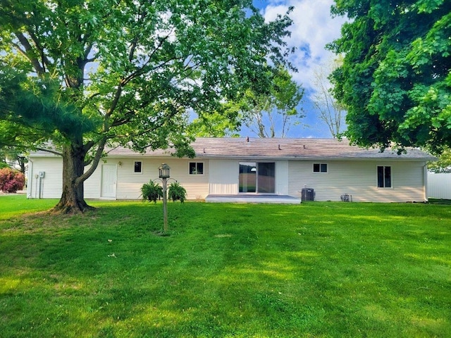 4624 3b Rd, Bremen, IN 46506 - back of house featuring a lawn and central air condition unit