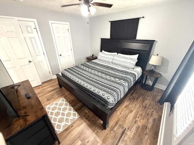 3833 Clover Dr, Newburgh, IN 47630 - bedroom featuring wood finished floors, a ceiling fan, and baseboards