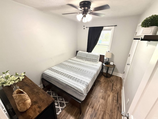 3833 Clover Dr, Newburgh, IN 47630 - bedroom featuring wood finished floors, ceiling fan, and baseboards