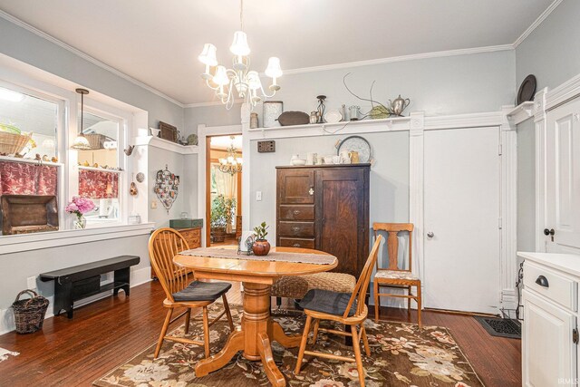 411 S 6th St, Goshen, IN 46526 - dining area featuring a chandelier, wood finished floors, and ornamental molding