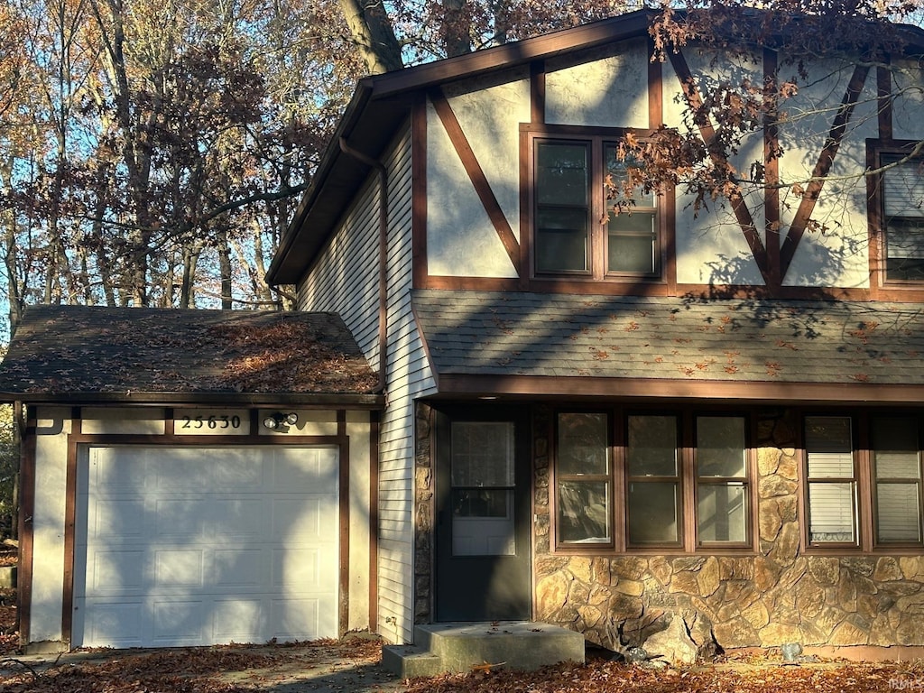 25632 Thelmadale Dr, Elkhart, IN 46514 - view of front of home with stone siding and a garage