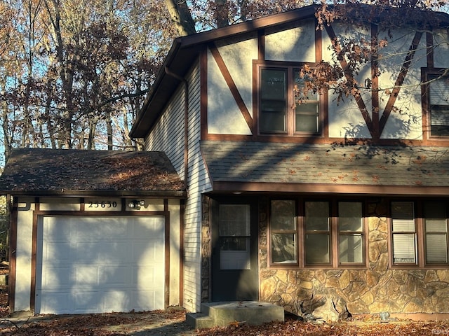 25632 Thelmadale Dr, Elkhart, IN 46514 - view of front of home with stone siding and a garage