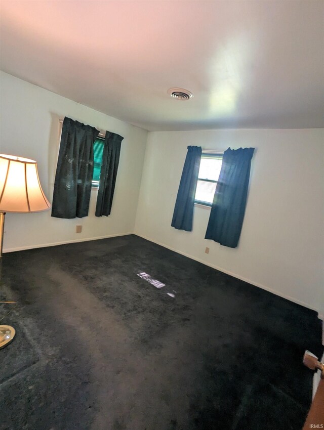 417 S Linn Grove Ave, Berne, IN 46711 - unfurnished room featuring dark carpet and baseboards