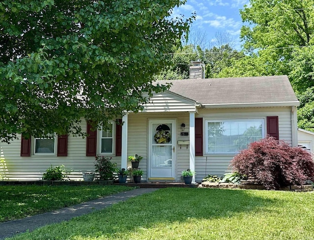 2820 N Bedford Ave, Evansville, IN 47711 - view of front of house with a front yard and a chimney
