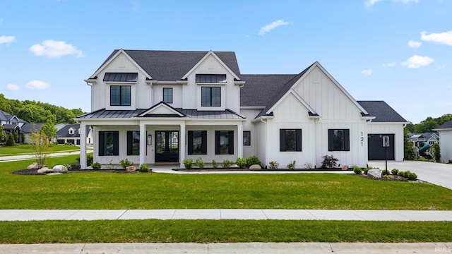 121 Jadis Ct, Fort Wayne, IN 46845 - modern inspired farmhouse with a garage, board and batten siding, a front lawn, and concrete driveway