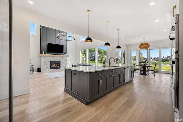121 Jadis Ct, Fort Wayne, IN 46845 - kitchen featuring a sink, dishwasher, healthy amount of natural light, a stone fireplace, and recessed lighting