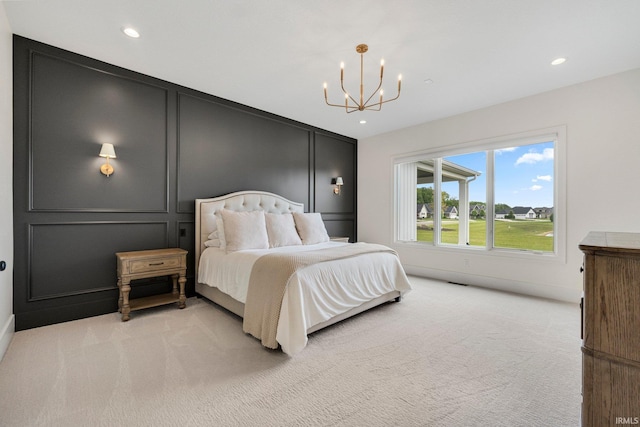 121 Jadis Ct, Fort Wayne, IN 46845 - bedroom with light carpet, a chandelier, a decorative wall, and recessed lighting