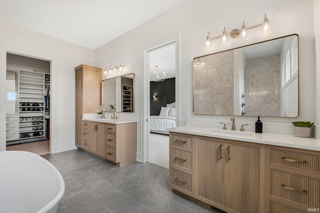 121 Jadis Ct, Fort Wayne, IN 46845 - ensuite bathroom featuring two vanities, a soaking tub, and a walk in closet