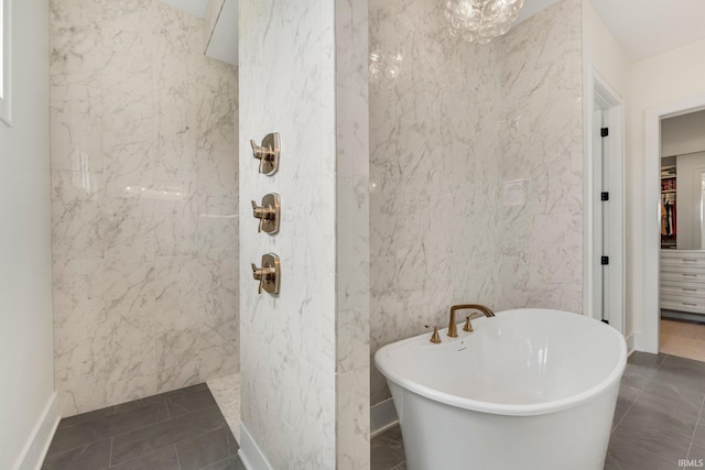 121 Jadis Ct, Fort Wayne, IN 46845 - full bath featuring a marble finish shower, a soaking tub, a walk in closet, baseboards, and tile patterned flooring