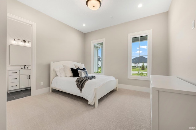 121 Jadis Ct, Fort Wayne, IN 46845 - carpeted bedroom featuring a sink, baseboards, ensuite bathroom, and recessed lighting