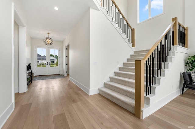 121 Jadis Ct, Fort Wayne, IN 46845 - entryway with stairway, a chandelier, light wood-style floors, and recessed lighting