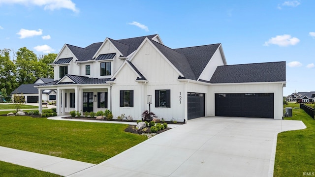 121 Jadis Ct, Fort Wayne, IN 46845 - modern inspired farmhouse featuring an attached garage, a front lawn, driveway, and board and batten siding