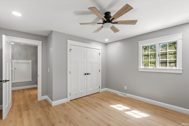 633 S Ravencrest Ave, Bloomington, IN 47401 - unfurnished bedroom featuring baseboards, light wood-type flooring, recessed lighting, a closet, and ceiling fan