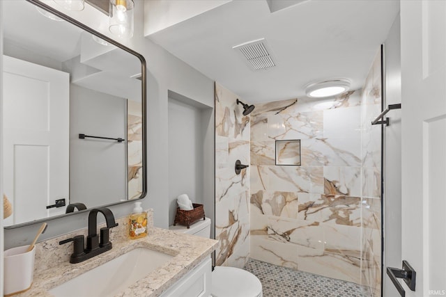 633 S Ravencrest Ave, Bloomington, IN 47401 - full bathroom with vanity, toilet, and a marble finish shower