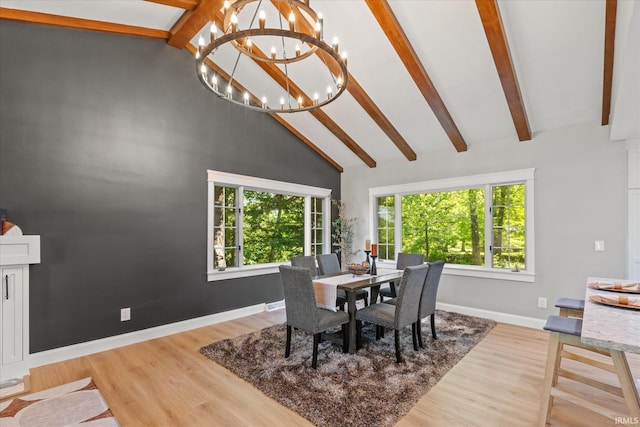 633 S Ravencrest Ave, Bloomington, IN 47401 - dining room featuring baseboards, beamed ceiling, light wood-type flooring, a chandelier, and high vaulted ceiling