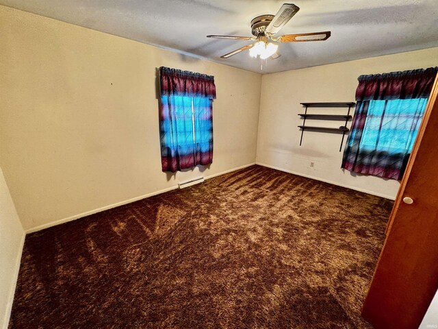 2940 19th St, Columbus, IN 47201 - unfurnished room featuring carpet flooring, a ceiling fan, a baseboard heating unit, and baseboards