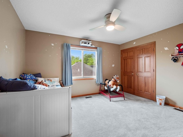 10215 Tidewater Trl, Fort Wayne, IN 46845 - bedroom with carpet flooring, baseboards, ceiling fan, and a textured ceiling
