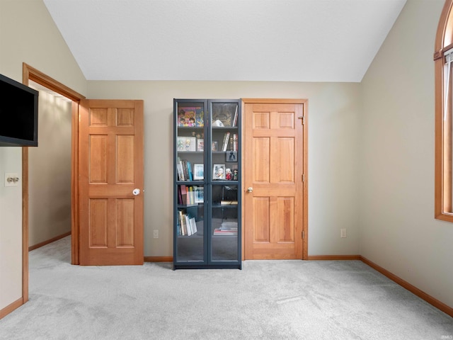 10215 Tidewater Trl, Fort Wayne, IN 46845 - carpeted empty room featuring lofted ceiling and baseboards