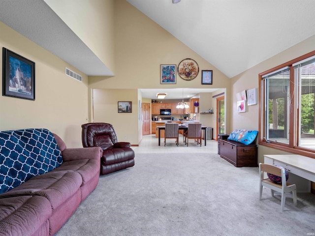 10215 Tidewater Trl, Fort Wayne, IN 46845 - living area with high vaulted ceiling, light colored carpet, and a chandelier