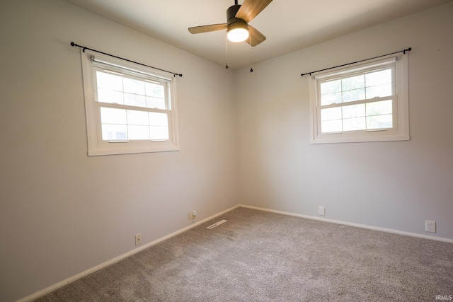 113 W Berkeley Ave, Evansville, IN 47710 - unfurnished room with healthy amount of natural light, ceiling fan, carpet flooring, and baseboards