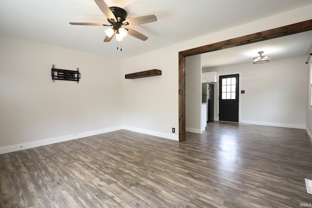 113 W Berkeley Ave, Evansville, IN 47710 - empty room featuring ceiling fan, dark wood-style floors, and baseboards