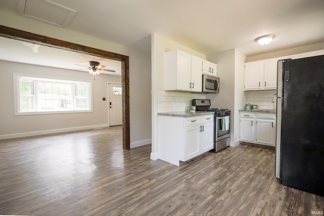113 W Berkeley Ave, Evansville, IN 47710 - kitchen with stainless steel appliances, dark wood-style flooring, tasteful backsplash, and white cabinetry