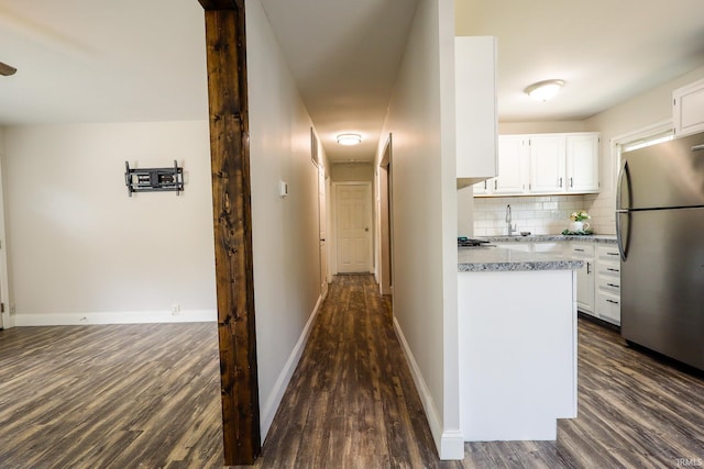 113 W Berkeley Ave, Evansville, IN 47710 - kitchen with freestanding refrigerator, dark wood finished floors, white cabinetry, and tasteful backsplash