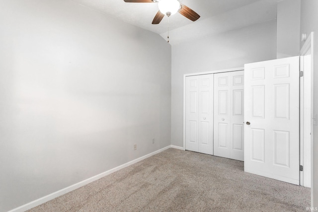 5709 Bayswater Ct, South Bend, IN 46614 - unfurnished bedroom featuring carpet flooring, vaulted ceiling, a closet, baseboards, and ceiling fan
