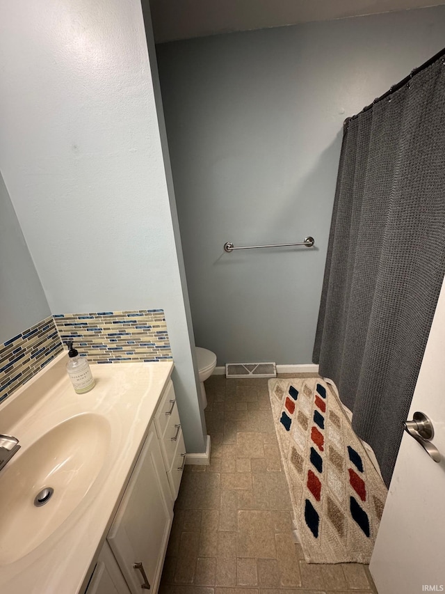 1414 Spear St, Rochester, IN 46975 - full bath with toilet, vanity, and baseboards