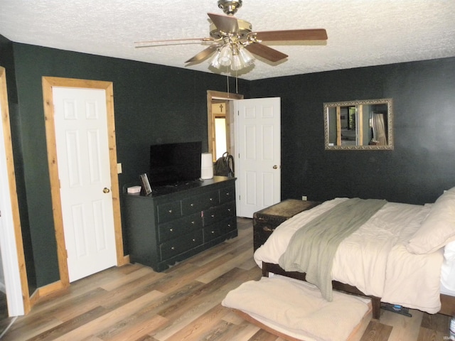3116 Truesdel Rd, Gosport, IN 47433 - bedroom featuring a textured ceiling, wood finished floors, and a ceiling fan