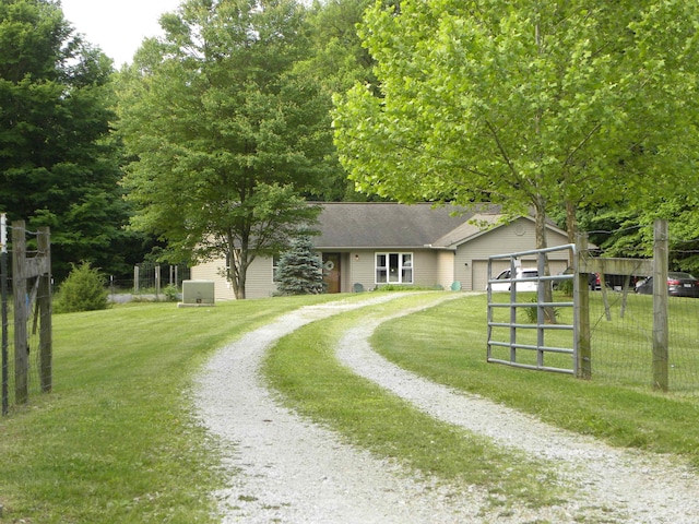 3116 Truesdel Rd, Gosport, IN 47433 - ranch-style home with driveway, an attached garage, and roof with shingles