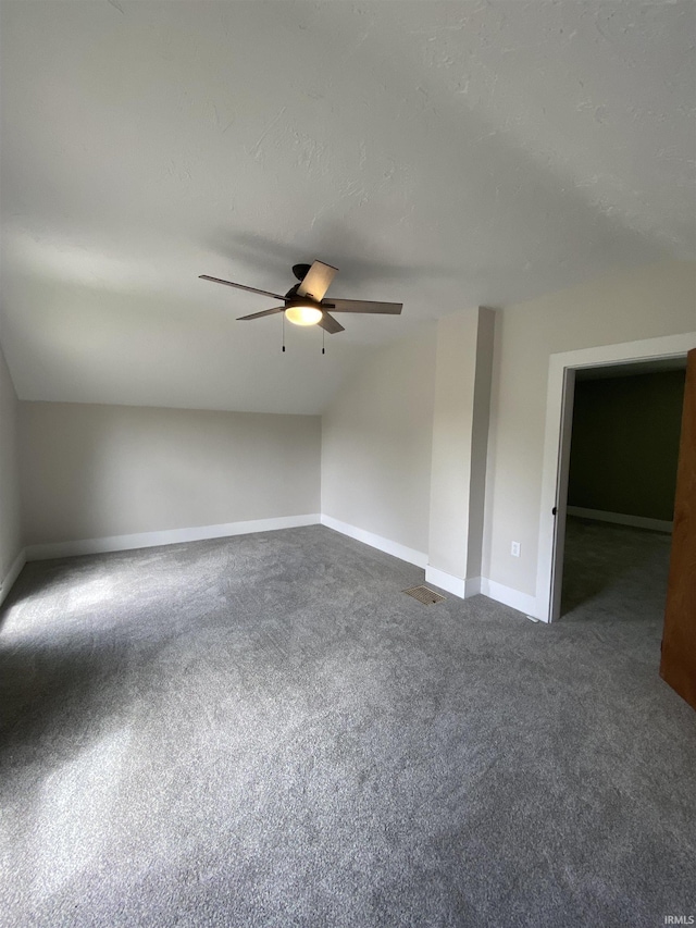 1824 Boxcar Ln, Auburn, IN 47606 - bonus room featuring dark colored carpet, a ceiling fan, lofted ceiling, and baseboards