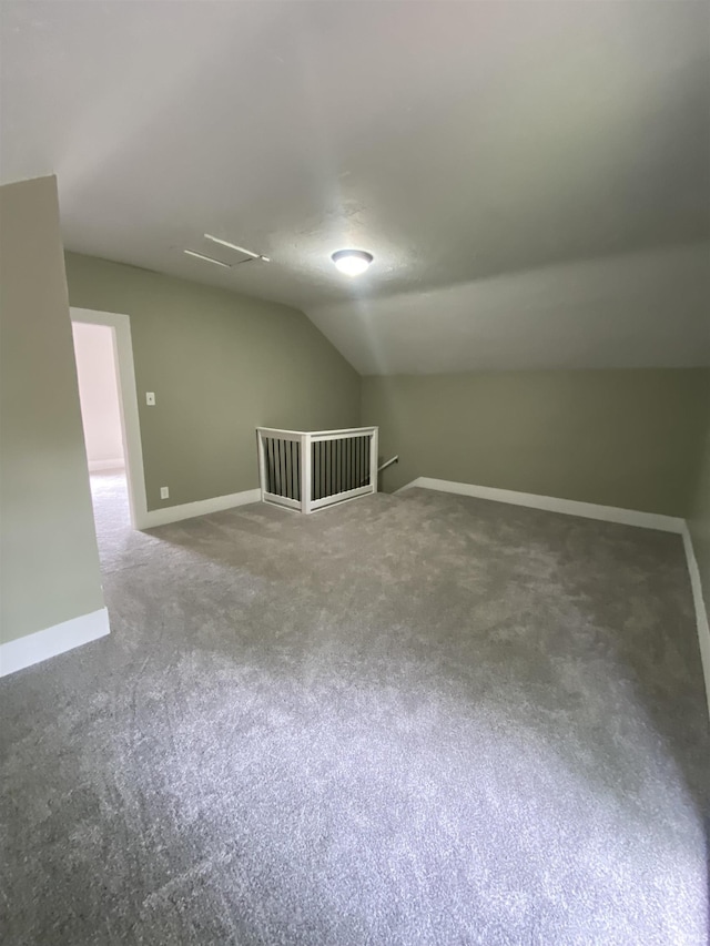 1824 Boxcar Ln, Auburn, IN 47606 - additional living space featuring carpet floors, lofted ceiling, and baseboards