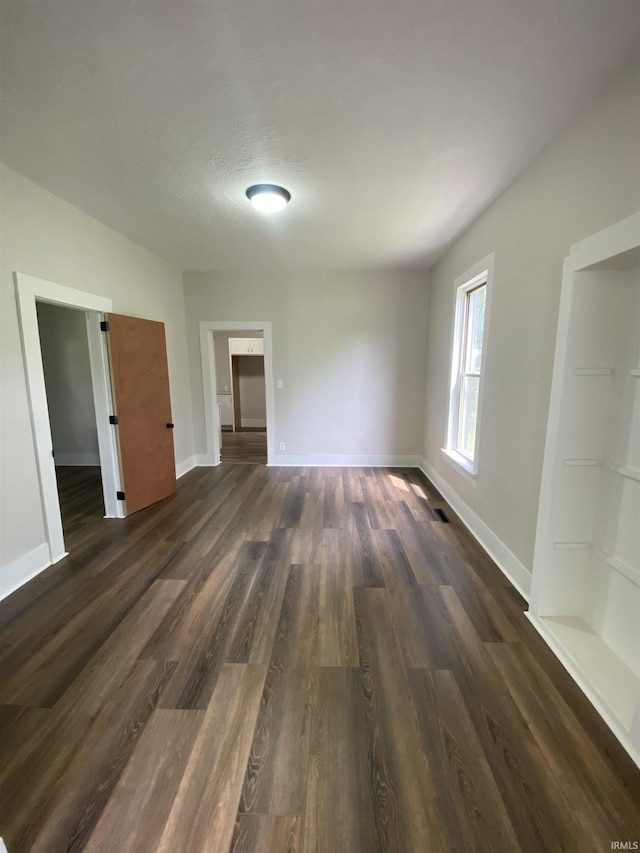 1824 Boxcar Ln, Auburn, IN 47606 - spare room with dark wood-style flooring and baseboards