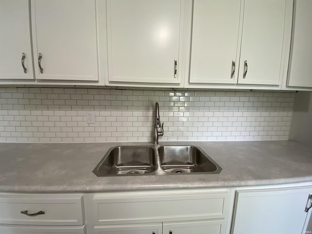 1824 Boxcar Ln, Auburn, IN 47606 - kitchen with a sink, white cabinets, and backsplash